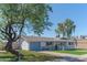 Beautiful single-story home with a well-manicured front yard and inviting entrance at 1749 E Medlock Dr, Phoenix, AZ 85016