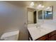 Well-lit bathroom boasts a vanity with a mirror and vanity lighting at 17914 N Fiano Dr, Maricopa, AZ 85138