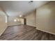 Bright and airy living room with dark plank flooring and open layout at 17914 N Fiano Dr, Maricopa, AZ 85138