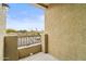 Balcony overlooking a residential area with palm trees on a sunny day at 18250 N Cave Creek Rd # 105, Phoenix, AZ 85032