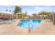 Outdoor pool with lounge chairs and a shaded cabana offers a relaxing amenity at 18250 N Cave Creek Rd # 105, Phoenix, AZ 85032