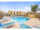 Outdoor pool with lounge chairs and a shaded cabana provides a relaxing amenity at 18250 N Cave Creek Rd # 105, Phoenix, AZ 85032