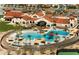 Aerial view of community center with beautiful pools, landscaping, and terra cotta roofs at 18742 N 269Th Ln, Buckeye, AZ 85396