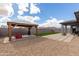 Backyard featuring a gazebo, lounge chairs, and desert landscaping at 2013 E Brooklyn Dr, Casa Grande, AZ 85122