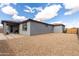 Desert landscaped backyard featuring a patio and minimal lawn at 2013 E Brooklyn Dr, Casa Grande, AZ 85122