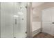 Modern bathroom with glass shower, white subway tile, and soaking tub at 2013 E Brooklyn Dr, Casa Grande, AZ 85122