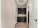 Hallway with dark cabinets offering plenty of storage, with wood-look tile floors at 2013 E Brooklyn Dr, Casa Grande, AZ 85122