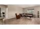 Cozy living room with neutral walls, wood-look tile, comfortable seating, and modern decor at 2013 E Brooklyn Dr, Casa Grande, AZ 85122