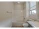 Bathroom featuring a white tub and shower combination, window, and white countertops at 22644 E Quintero Ct, Queen Creek, AZ 85142