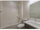 Bathroom showcasing a shower-tub combo, toilet, and vanity with modern fixtures and finishes at 22644 E Quintero Ct, Queen Creek, AZ 85142