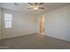 Bedroom with carpet, ceiling fan, natural light and walk-in closet at 22644 E Quintero Ct, Queen Creek, AZ 85142