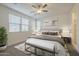 Bedroom with natural light, neutral tones, and simple decor creating a peaceful atmosphere at 22644 E Quintero Ct, Queen Creek, AZ 85142