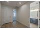 Bright hallway showcasing wood floors with views of a bathroom and bedroom at 22644 E Quintero Ct, Queen Creek, AZ 85142