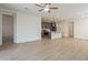 Open concept living space with a view of the modern kitchen and ample natural light at 22644 E Quintero Ct, Queen Creek, AZ 85142