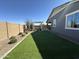 Large backyard with artificial grass and mature landscaping at 22808 E Roundup Way, Queen Creek, AZ 85142