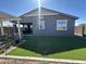 Lush backyard with verdant artificial grass, perfect for outdoor activities at 22808 E Roundup Way, Queen Creek, AZ 85142