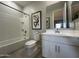 Bathroom featuring a bathtub, vanity, and tiled floors, plus a decorative print at 22808 E Roundup Way, Queen Creek, AZ 85142