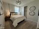 Cozy bedroom featuring soft textures, neutral tones, and ample natural light at 22808 E Roundup Way, Queen Creek, AZ 85142