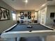 Entertaining game room with a billiards table, comfortable seating, and tasteful decor at 22808 E Roundup Way, Queen Creek, AZ 85142