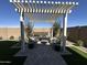 Stylish patio with a pergola, perfect for relaxation and entertaining at 22808 E Roundup Way, Queen Creek, AZ 85142