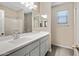 Bathroom showcasing a spacious countertop, ample cabinet space, and a window at 24220 W Ripple Rd, Buckeye, AZ 85326