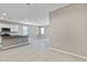 Spacious living area with tile flooring adjacent to the kitchen, great for entertaining guests at 24220 W Ripple Rd, Buckeye, AZ 85326