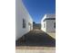 Minimalist backyard between two modern homes with gravel landscaping at 2440 W Morten Ave, Phoenix, AZ 85021