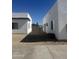 View of minimalist backyard between two modern homes with gravel landscaping at 2440 W Morten Ave, Phoenix, AZ 85021