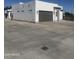 Modern home exterior featuring gray garage door and minimalist design elements at 2440 W Morten Ave, Phoenix, AZ 85021