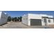 Street view of modern home with a gray garage door and minimalist design at 2440 W Morten Ave, Phoenix, AZ 85021