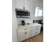 Close up of modern kitchen area featuring stainless steel microwave and appliances at 2440 W Morten Ave, Phoenix, AZ 85021