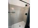 Modern shower features gray subway tile surround and matte black fixtures at 2440 W Morten Ave, Phoenix, AZ 85021