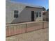 The backyard features gravel, a brick path and a fence at 2441 W Morten Ave, Phoenix, AZ 85021