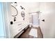 Bathroom features a double vanity with round mirrors and walk-in shower at 2441 W Morten Ave, Phoenix, AZ 85021