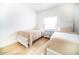 Bedroom features two beds and dresser accented by wood-look floors at 2441 W Morten Ave, Phoenix, AZ 85021