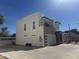 Modern two-story home exterior featuring clean lines, a two car garage and a balcony at 2441 W Morten Ave, Phoenix, AZ 85021