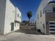 Modern home exterior featuring clean lines, neutral colors, and a well-maintained front yard at 2441 W Morten Ave, Phoenix, AZ 85021