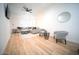 Cozy living room with light wood floors, neutral furnishings, and a ceiling fan at 2441 W Morten Ave, Phoenix, AZ 85021