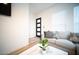 Stylish living room with modern furnishings, a decorative coffee table, and a view of the front door at 2441 W Morten Ave, Phoenix, AZ 85021