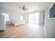 Large main bedroom with light wood flooring, white furniture, and bright natural light at 2441 W Morten Ave, Phoenix, AZ 85021