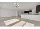 Bright and airy living space featuring tile flooring, recessed lighting, and dark cabinetry in an open layout at 2524 N Pony Ln, Casa Grande, AZ 85122