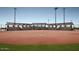 Well-maintained baseball field with covered bleachers, ready for the next game at 2649 N Riverside Dr, Florence, AZ 85132