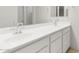 Bathroom featuring double sinks with modern faucets and white cabinetry at 2649 N Riverside Dr, Florence, AZ 85132