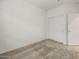 Bedroom showcasing neutral carpet, white walls, and a large closet at 2649 N Riverside Dr, Florence, AZ 85132