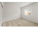 A bedroom with neutral carpet, white walls, a window, and a closet at 2649 N Riverside Dr, Florence, AZ 85132