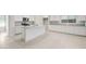 Open kitchen with tile floors, white cabinets, granite countertops, and stainless appliances at 2649 N Riverside Dr, Florence, AZ 85132