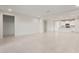 Large living room with bright tile floors leading to the kitchen and other rooms at 2649 N Riverside Dr, Florence, AZ 85132