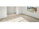 Neutral living room featuring carpeted floors, a window, and a front door at 2649 N Riverside Dr, Florence, AZ 85132