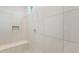 Walk-in shower showcasing sleek tilework and a built-in bench at 2649 N Riverside Dr, Florence, AZ 85132