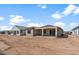 Newly constructed home showcasing the backyard and patio area at 26957 W Lone Cactus Dr, Buckeye, AZ 85396